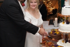 Groom-Bride-Cutting-Cake-Reception