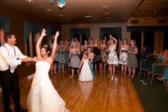Groom-Bride-Throwing-Bouquet-Reception