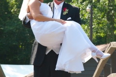 Groom-Carring_Bride-Bridge