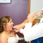 Katie & CJs Sheboygan Wedding - Bride and Groom feeding each other cake at the reception