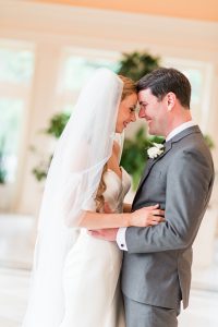 Bride and Groom Smiling at each other on their wedding day