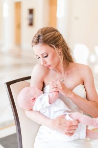 Bride Sitting on Chair holding her baby